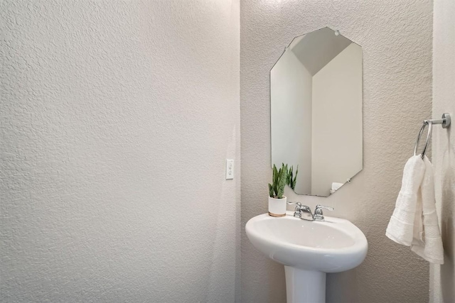 516 E Slaughter Ln Unit 1101, Austin, TX 78744 - bathroom with a sink and a textured wall