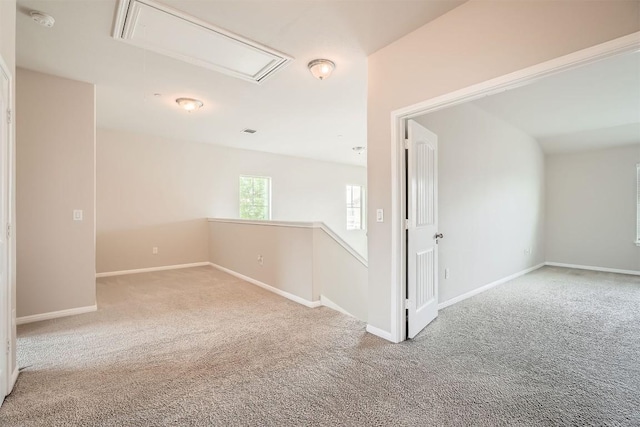 516 E Slaughter Ln Unit 1101, Austin, TX 78744 - carpeted empty room with baseboards, visible vents, and attic access
