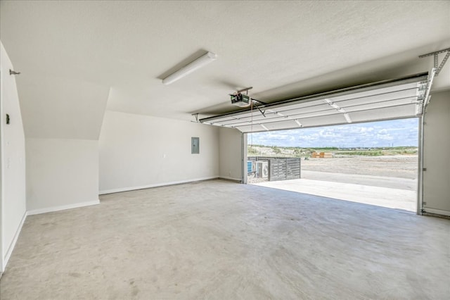garage with baseboards, a garage door opener, and electric panel