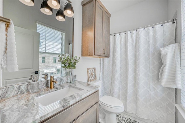 bathroom with vanity, a shower with curtain, and toilet