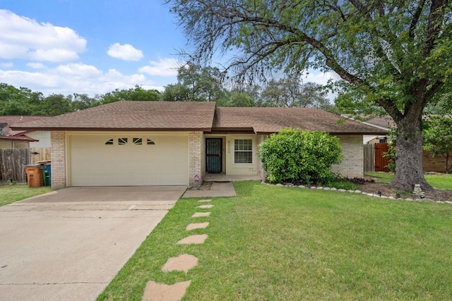 ranch-style home featuring brick siding, a garage, and fence