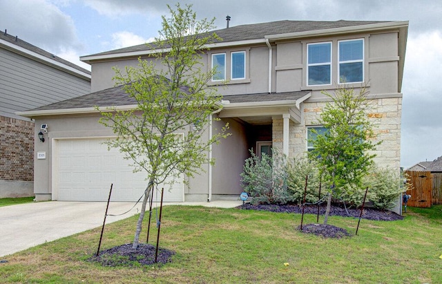 traditional-style house with concrete driveway, a front lawn, stone siding, and stucco siding