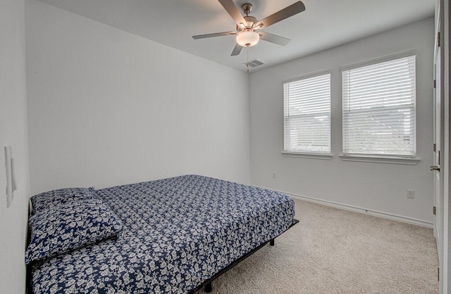 17325 Casanova Ave, Pflugerville, TX 78660 - carpeted bedroom with baseboards and a ceiling fan
