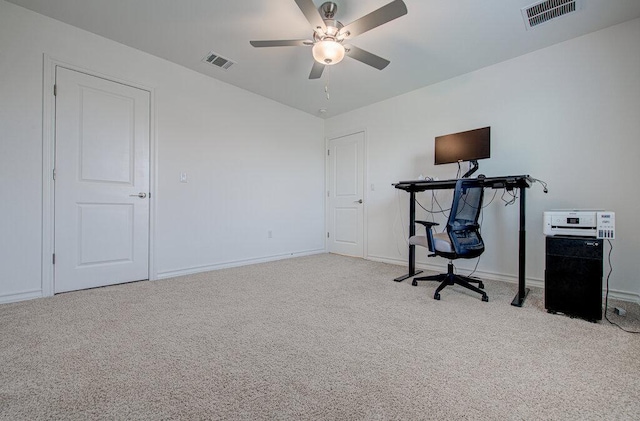 unfurnished office featuring ceiling fan, visible vents, baseboards, and carpet