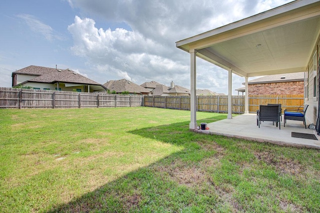 view of yard with a patio and a fenced backyard