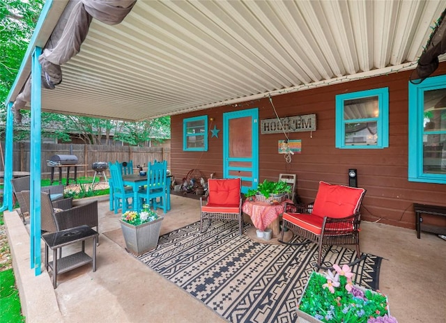 1207 Flag St, Llano, TX 78643 - view of patio with fence and outdoor dining space
