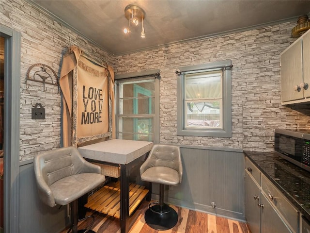 1207 Flag St, Llano, TX 78643 - dining area with crown molding and wood finished floors