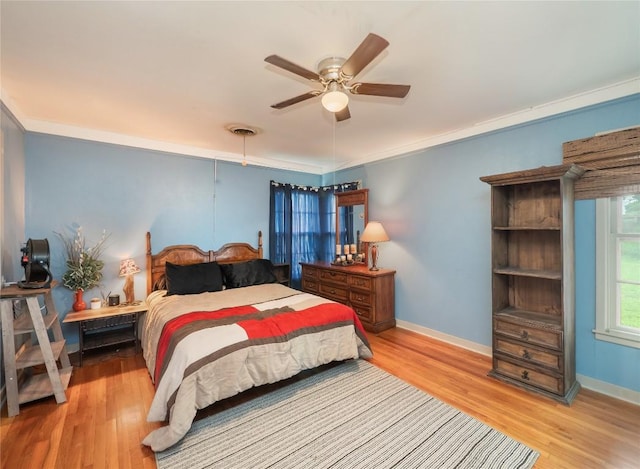 1207 Flag St, Llano, TX 78643 - bedroom with baseboards, ornamental molding, wood finished floors, and visible vents