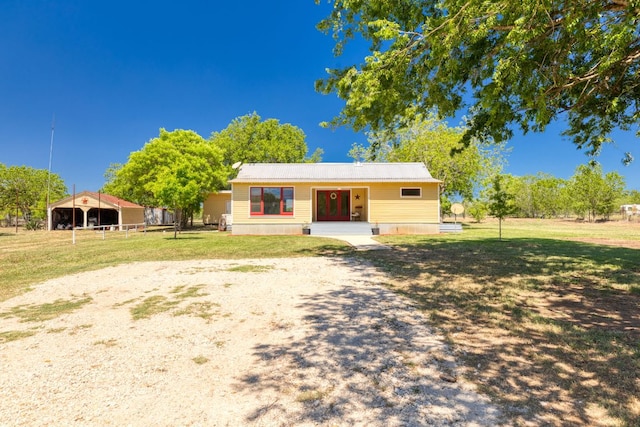 bungalow-style home featuring a front lawn