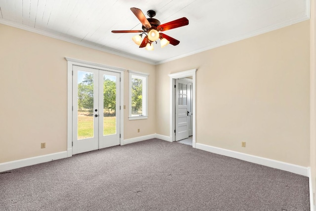 empty room featuring french doors, ornamental molding, ceiling fan, and carpet flooring