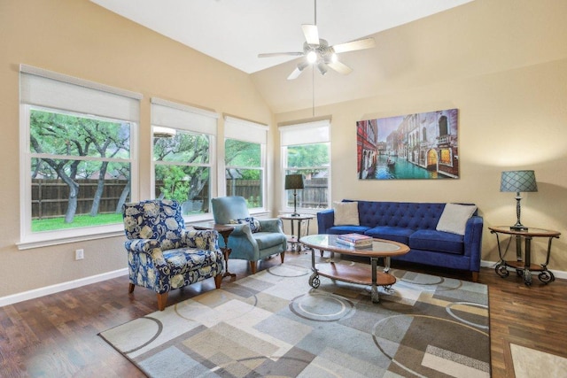 living room with a ceiling fan, baseboards, a wealth of natural light, and wood finished floors
