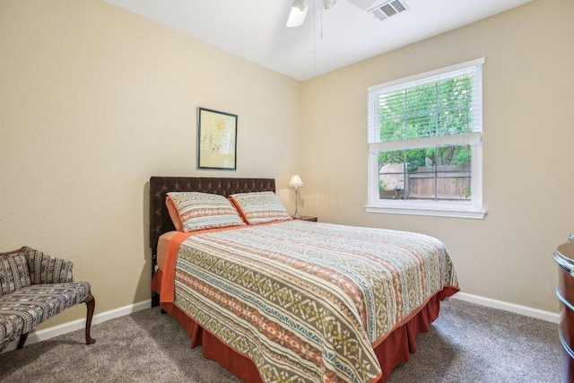 bedroom featuring visible vents, carpet flooring, baseboards, and a ceiling fan