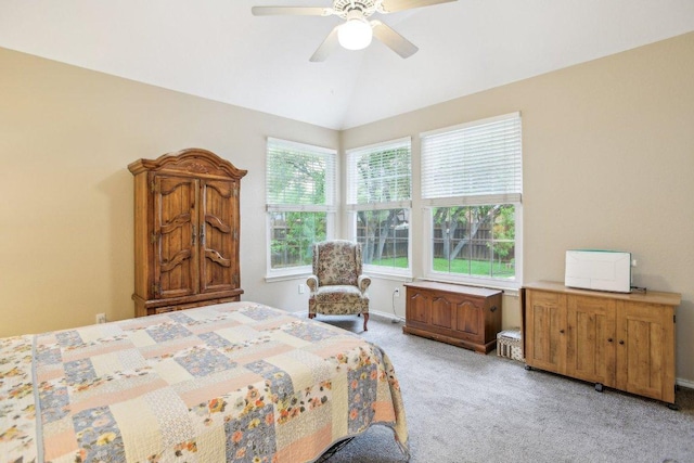 bedroom featuring ceiling fan, lofted ceiling, and light carpet
