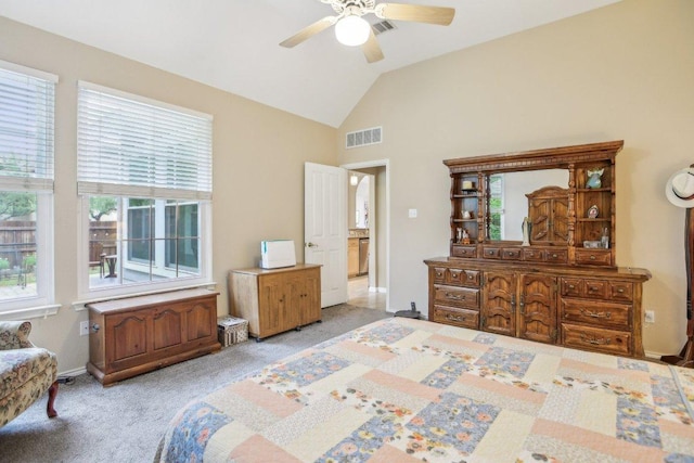 bedroom with visible vents, a ceiling fan, lofted ceiling, and light colored carpet