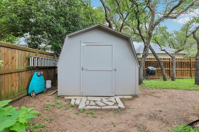 view of shed with a fenced backyard
