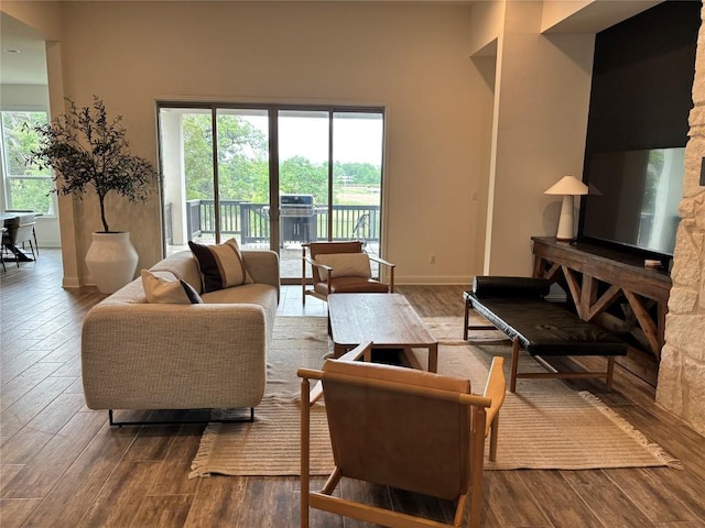 living room featuring baseboards and wood finished floors