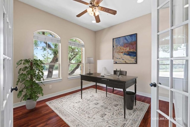 office area featuring baseboards, dark wood-style flooring, ceiling fan, and french doors
