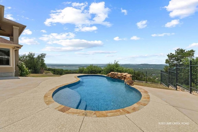view of swimming pool featuring fence, a fenced in pool, and a patio area