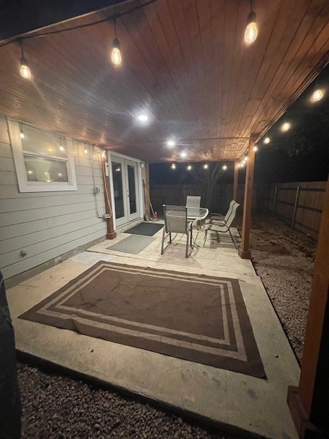 3508 Sandy Brook Dr, Round Rock, TX 78665 - patio at twilight with french doors and a fenced backyard