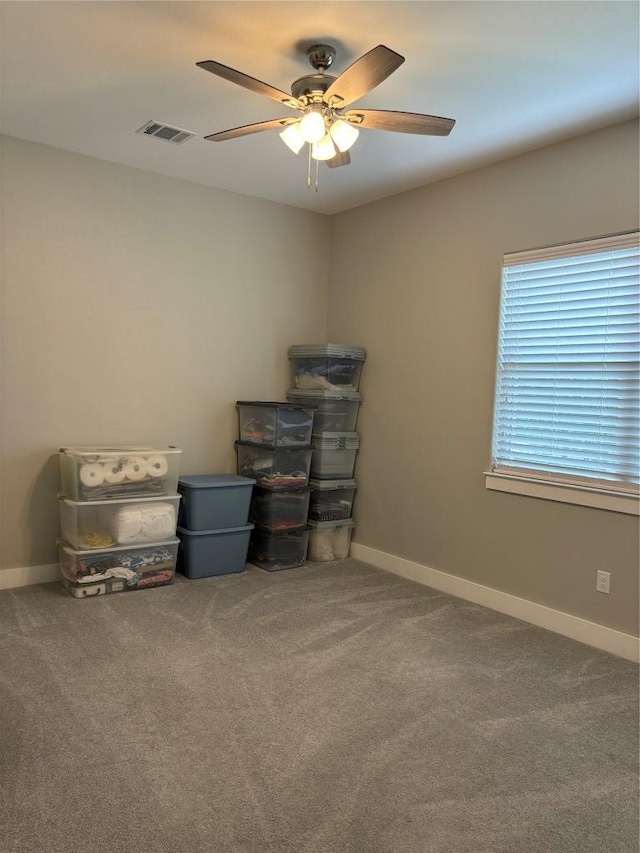 170 Nuuanu Rd, Bastrop, TX 78602 - spare room with a ceiling fan, carpet flooring, and baseboards