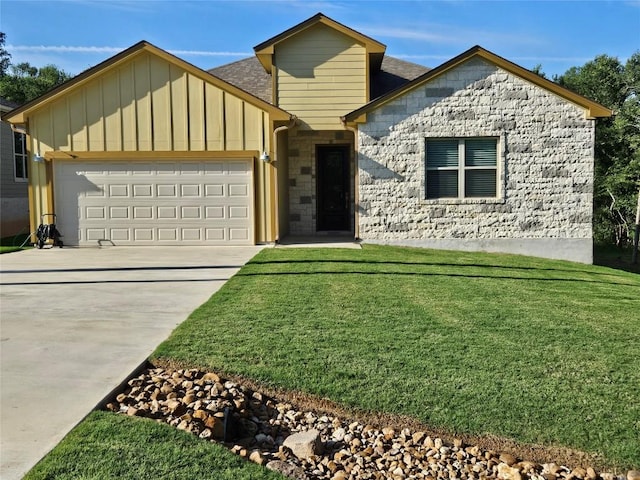 170 Nuuanu Rd, Bastrop, TX 78602 - view of front of house featuring board and batten siding, an attached garage, a front lawn, concrete driveway, and stone siding