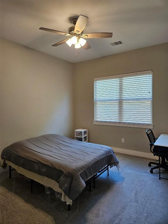 170 Nuuanu Rd, Bastrop, TX 78602 - bedroom featuring carpet floors, baseboards, and ceiling fan