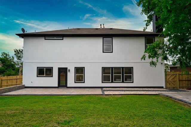 rear view of house with a patio