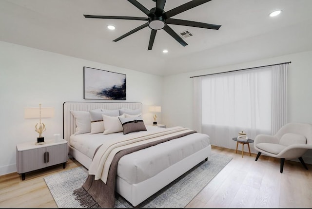 bedroom with light wood finished floors, recessed lighting, and ceiling fan