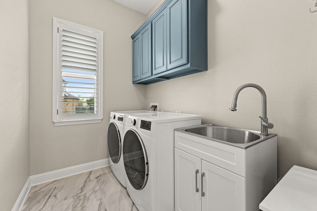 503 Wester Ross Ln, Lakeway, TX 78738 - laundry area featuring cabinet space, light marble finish floors, washing machine and dryer, and baseboards