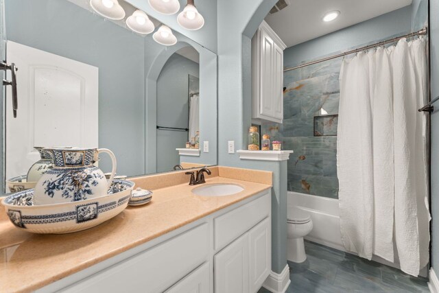 full bath with vanity, toilet, shower / tub combo, and visible vents