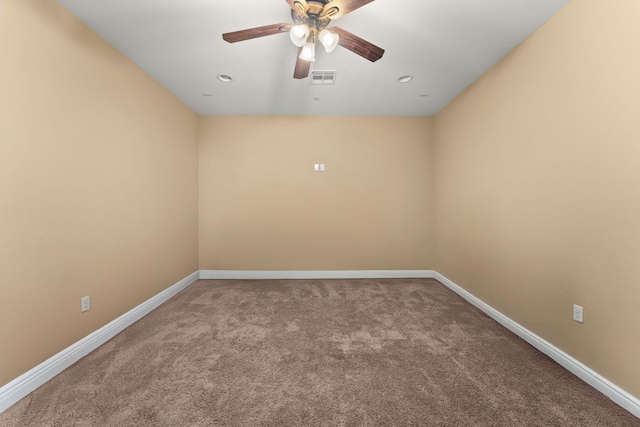 spare room with a ceiling fan, baseboards, and visible vents