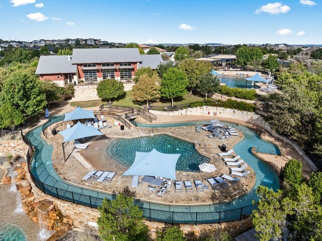 view of swimming pool with fence