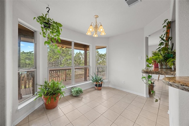 unfurnished sunroom featuring a chandelier and visible vents