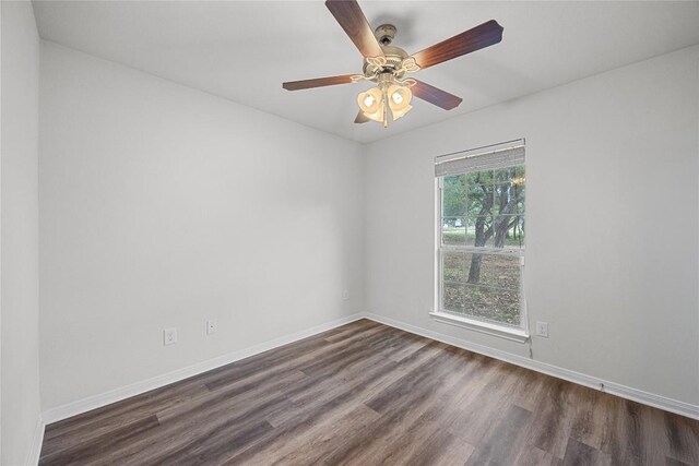 21607 Santa Carlo Ave, Lago Vista, TX 78645 - unfurnished room with dark wood-style flooring, baseboards, and ceiling fan