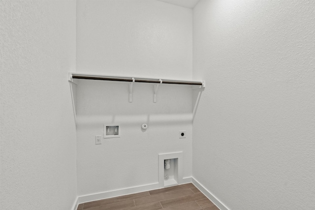 2705 Sage Ranch Dr Unit 25, Leander, TX 78641 - laundry room with gas dryer hookup, hookup for an electric dryer, washer hookup, wood finish floors, and baseboards