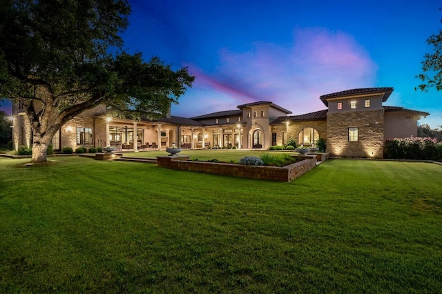 511 County Road 262, Georgetown, TX 78633 - rear view of property with stone siding, a lawn, stucco siding, and a tile roof