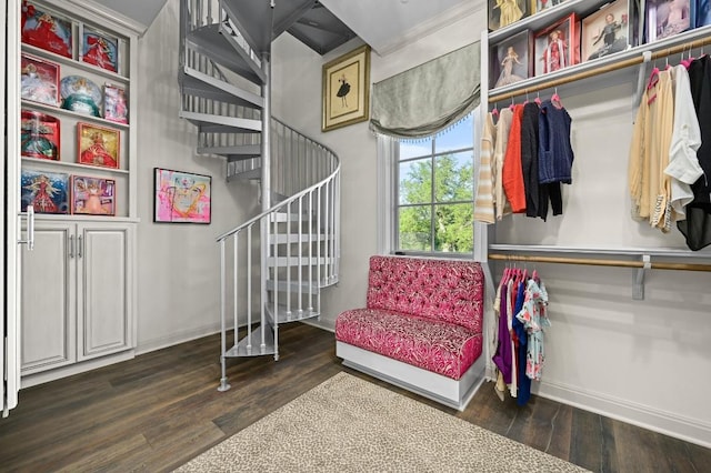 interior space featuring stairs, baseboards, and wood finished floors