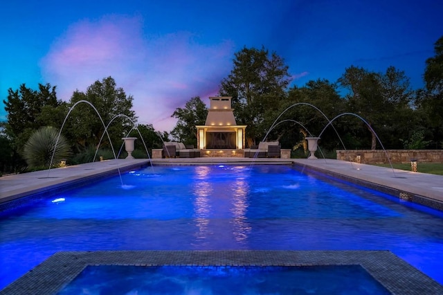 view of pool featuring a pool with connected hot tub