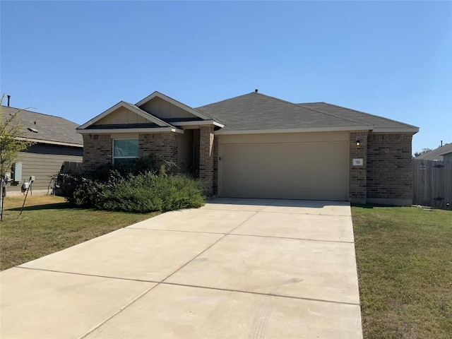 single story home featuring brick siding, an attached garage, and a front lawn