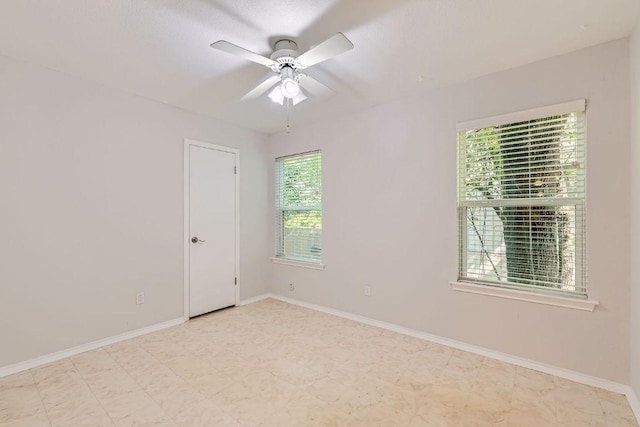 4318 Clarno Dr, Austin, TX 78749 - unfurnished room with healthy amount of natural light, ceiling fan, baseboards, and tile patterned floors