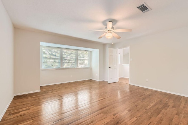 4318 Clarno Dr, Austin, TX 78749 - spare room featuring ceiling fan, wood finished floors, and baseboards