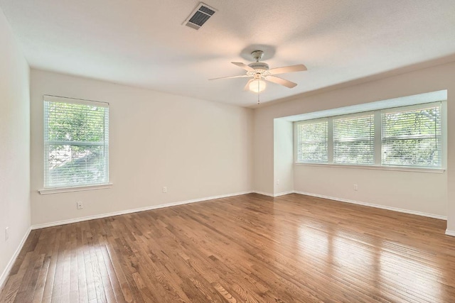 4318 Clarno Dr, Austin, TX 78749 - unfurnished room featuring wood-type flooring, a ceiling fan, and baseboards
