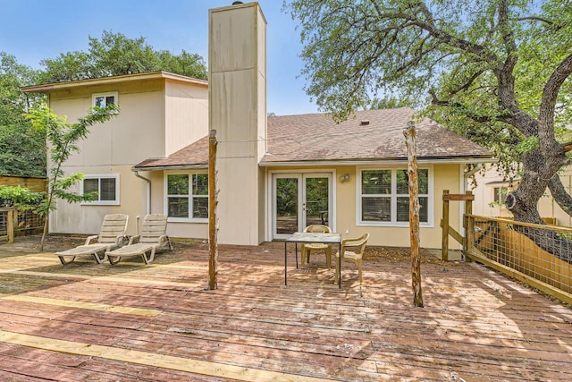4318 Clarno Dr, Austin, TX 78749 - rear view of house with a deck, a chimney, and roof with shingles