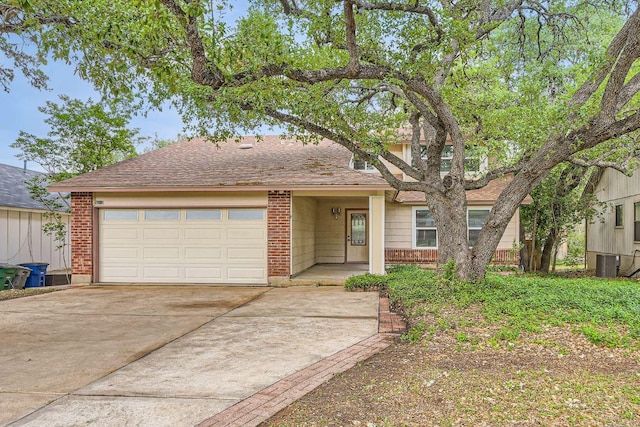 4318 Clarno Dr, Austin, TX 78749 - view of front of house featuring concrete driveway, a garage, and central AC