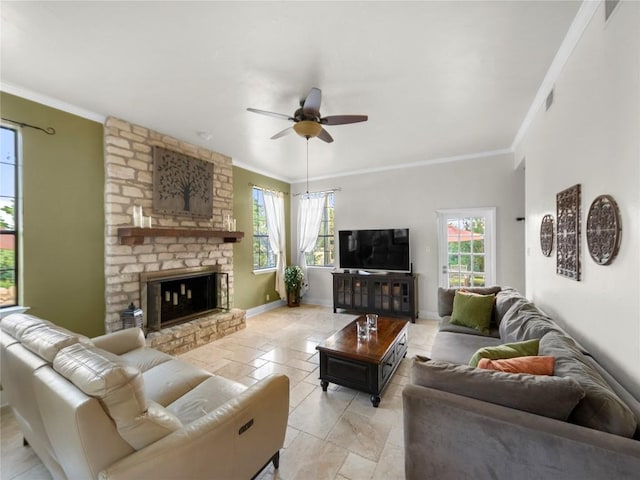 6407 Poncha Pass, Austin, TX 78749 - living area featuring plenty of natural light, a ceiling fan, crown molding, baseboards, and a large fireplace