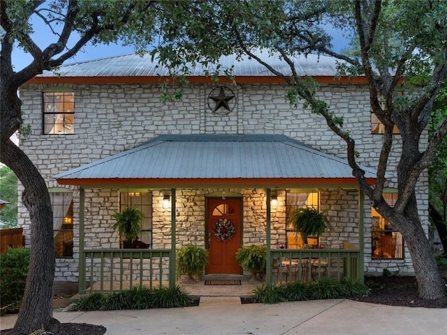 6407 Poncha Pass, Austin, TX 78749 - view of front of property with stone siding, a porch, and metal roof