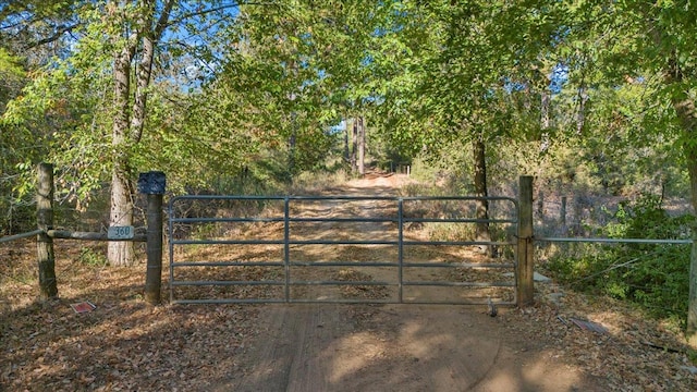 view of gate with fence