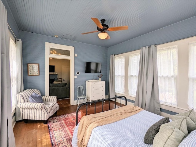 515 E 8th St, Georgetown, TX 78626 - bedroom with ceiling fan, hardwood / wood-style flooring, and visible vents