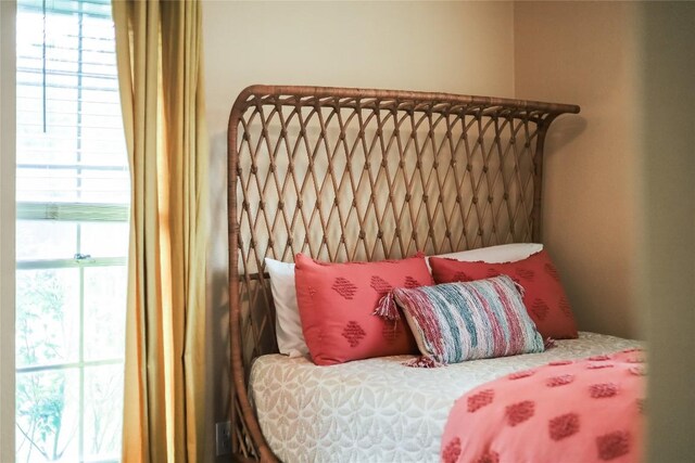 bedroom with multiple windows