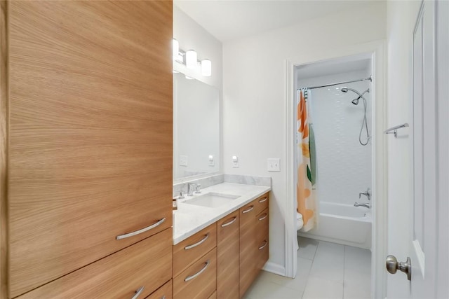 full bath with toilet, tile patterned floors, shower / tub combo with curtain, and vanity